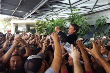 House representative Jair Bolsonaro being carried by fans