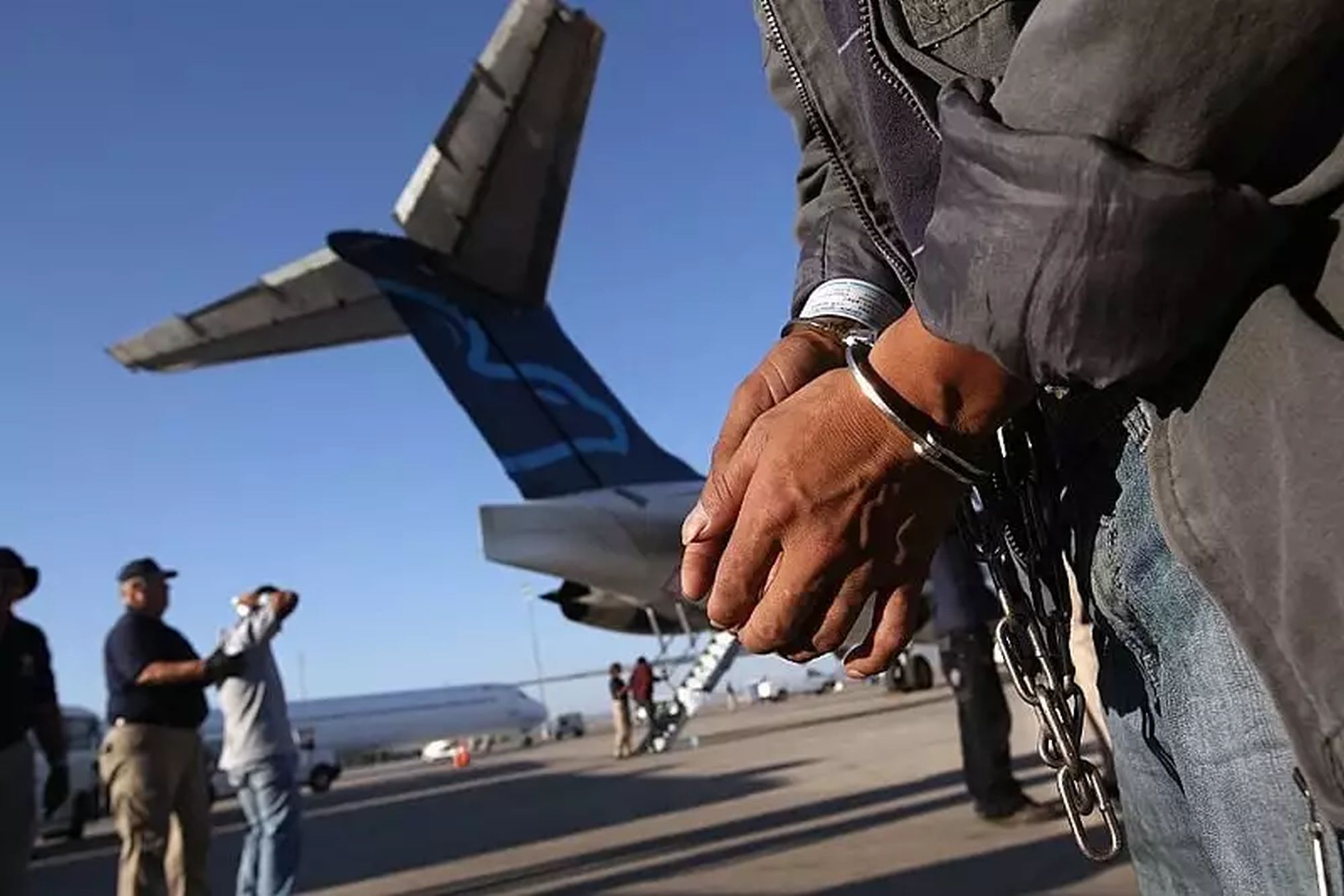 Brazilian migrants arrived handcuffed and shackled in Brazil after being deported from the US